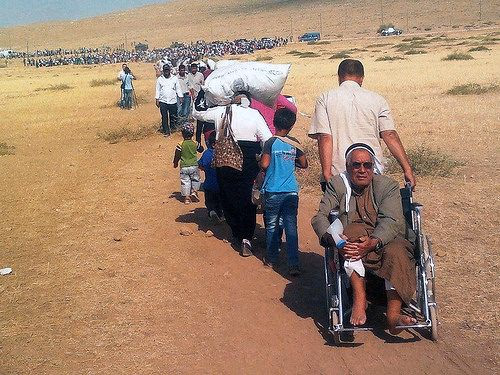 Flüchtende Menschen an der syrisch-türkischen Grenze, September 2014